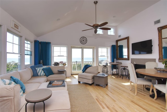 301 Lewis Walk, Cherry Grove, NY 11782 - living area featuring wood finished floors, high vaulted ceiling, a ceiling fan, and visible vents