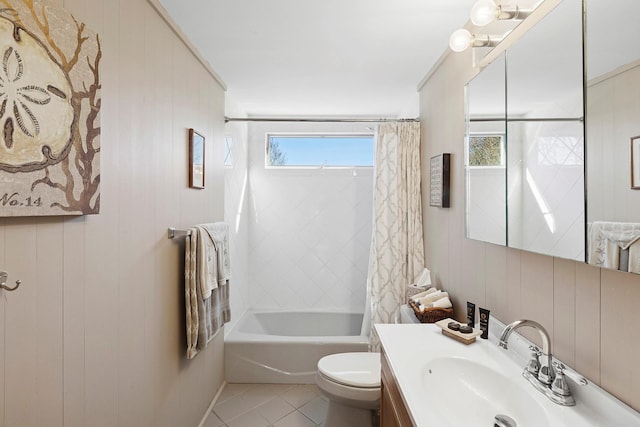 full bathroom featuring tile patterned flooring, toilet, vanity, and shower / bath combo