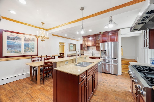 kitchen with stainless steel fridge, ventilation hood, a sink, light wood finished floors, and range