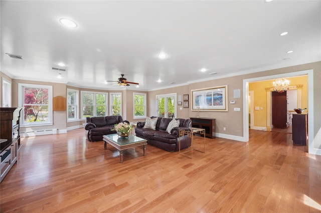 living room featuring crown molding, recessed lighting, baseboards, and a baseboard radiator