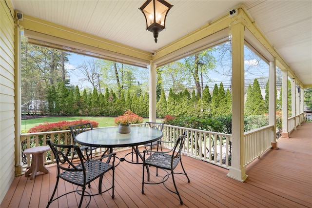 deck with outdoor dining area
