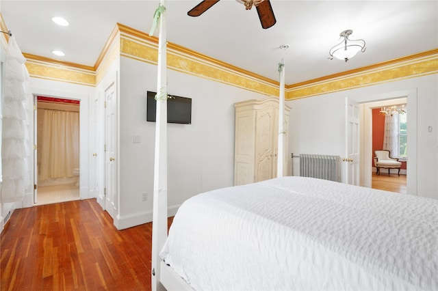 bedroom featuring wood finished floors, baseboards, a notable chandelier, ornamental molding, and recessed lighting