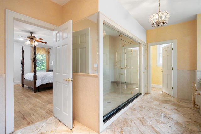 66 Drake Rd, Scarsdale, NY 10583 - full bath featuring a chandelier, ceiling fan, a shower stall, ensuite bathroom, and a wainscoted wall