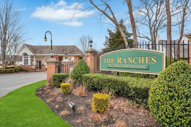 community sign with fence