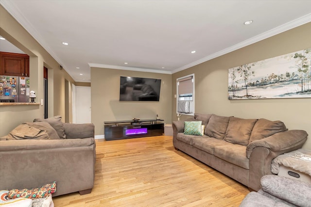 living area with recessed lighting, light wood-type flooring, baseboards, and ornamental molding