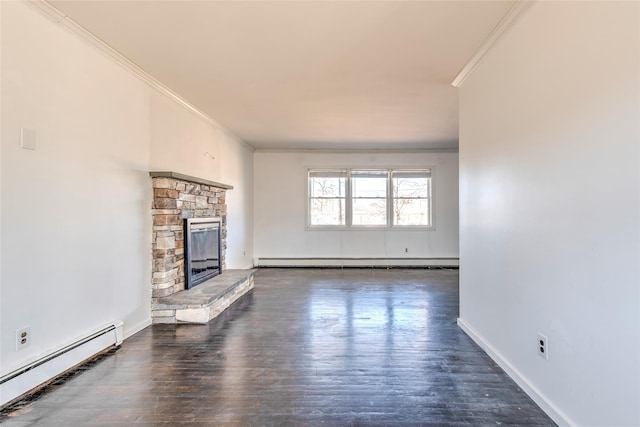 unfurnished living room with a baseboard heating unit, crown molding, wood finished floors, and a fireplace