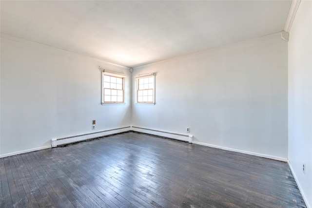 spare room with crown molding, dark wood-type flooring, baseboards, and a baseboard radiator