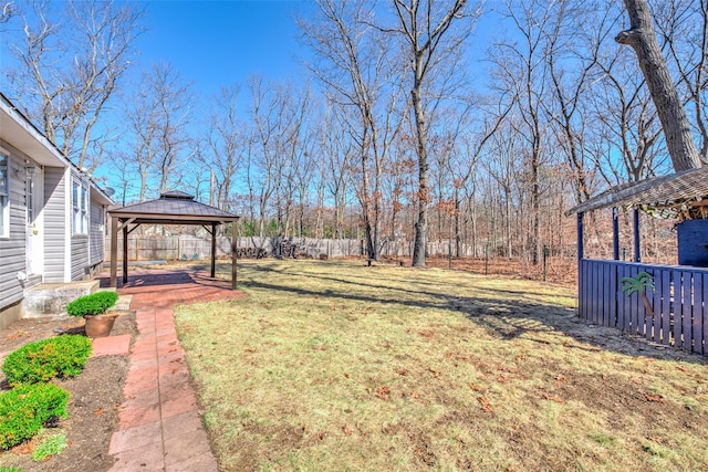 view of yard featuring a gazebo and fence