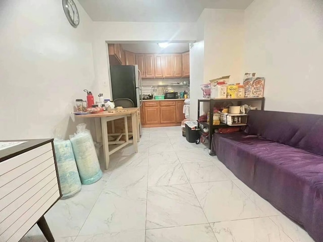 living area featuring marble finish floor