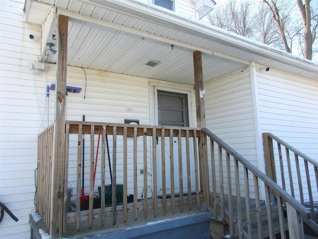 doorway to property with a porch