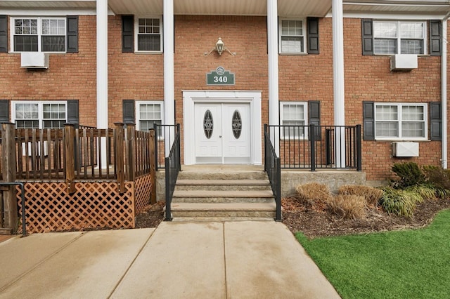 entrance to property with brick siding