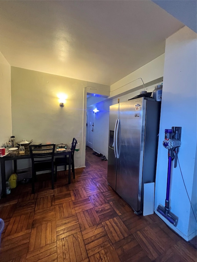 kitchen featuring stainless steel refrigerator with ice dispenser