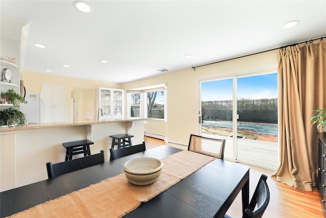 118 Paquatuck Ave, East Moriches, NY 11940 - dining area with light wood finished floors, visible vents, and recessed lighting