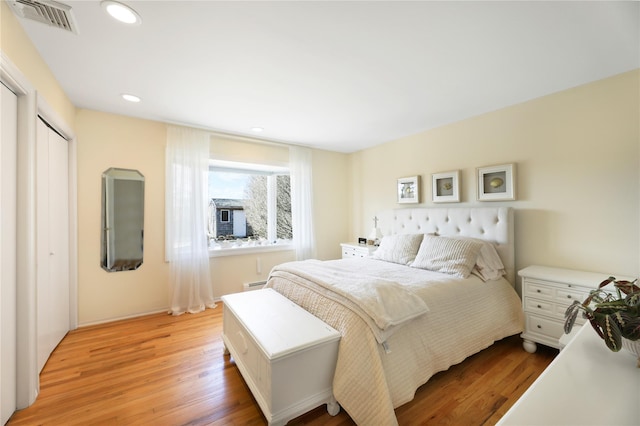 118 Paquatuck Ave, East Moriches, NY 11940 - bedroom with a baseboard radiator, recessed lighting, light wood finished floors, and visible vents