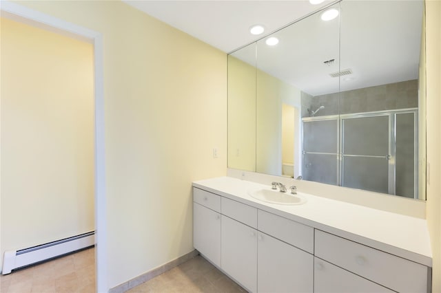 118 Paquatuck Ave, East Moriches, NY 11940 - bathroom with vanity, a baseboard heating unit, recessed lighting, a shower stall, and visible vents
