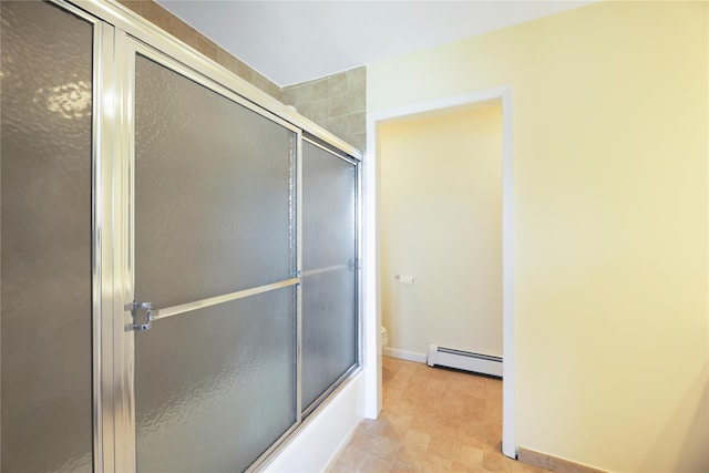 118 Paquatuck Ave, East Moriches, NY 11940 - bathroom with baseboards, toilet, and a baseboard radiator