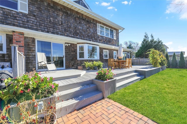 118 Paquatuck Ave, East Moriches, NY 11940 - back of property featuring fence, a lawn, and a deck