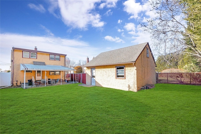 back of property featuring a patio, an outbuilding, a fenced backyard, a chimney, and a lawn