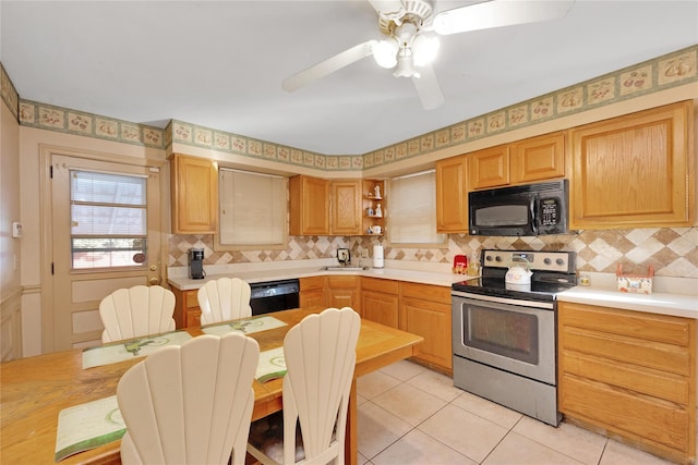 kitchen with black appliances, open shelves, a sink, backsplash, and light tile patterned floors