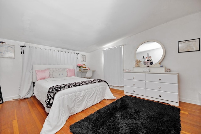 bedroom featuring wood finished floors