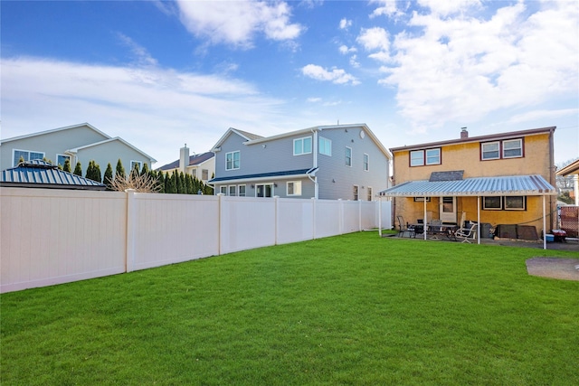 view of yard with a patio area and a fenced backyard