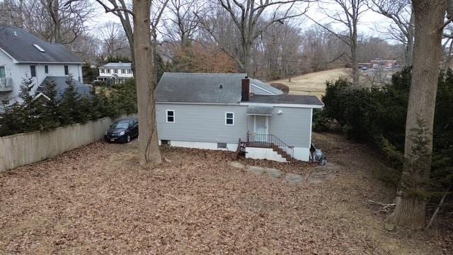 rear view of property with crawl space