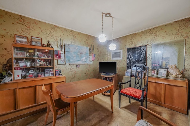 office area with wallpapered walls and crown molding