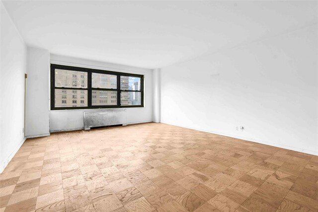 180 W End Ave Unit 23G, New York Manhattan, NY 10023 - empty room featuring radiator heating unit