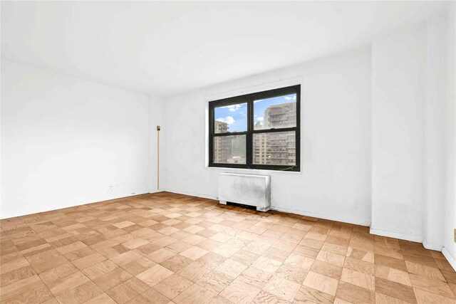 180 W End Ave Unit 23G, New York Manhattan, NY 10023 - unfurnished room featuring radiator heating unit
