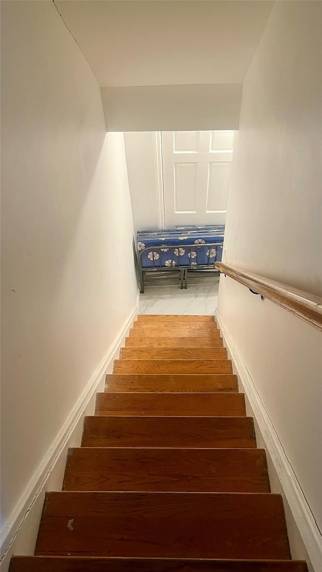 stairs featuring baseboards