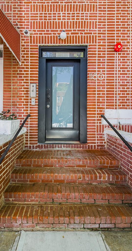 exterior details featuring brick siding