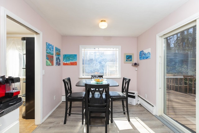4 Park Pl, Oyster Bay, NY 11771 - dining area featuring a wealth of natural light, light wood-type flooring, and baseboards