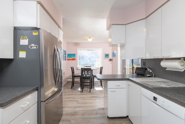 4 Park Pl, Oyster Bay, NY 11771 - kitchen with white cabinetry, dishwasher, a peninsula, and freestanding refrigerator