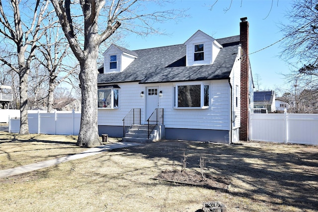 cape cod house with central AC, fence, roof with shingles, and a chimney