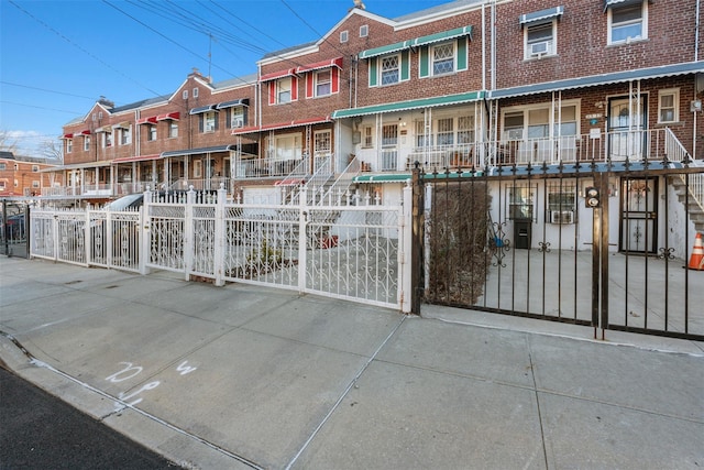 exterior space featuring a fenced front yard and a residential view