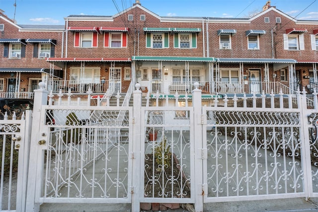 view of gate featuring a fenced front yard