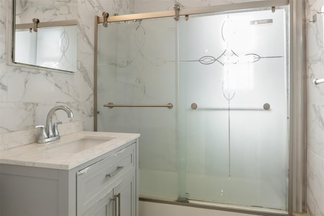 full bathroom with vanity and a shower with shower door