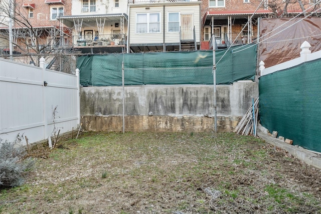 exterior space featuring entry steps and fence