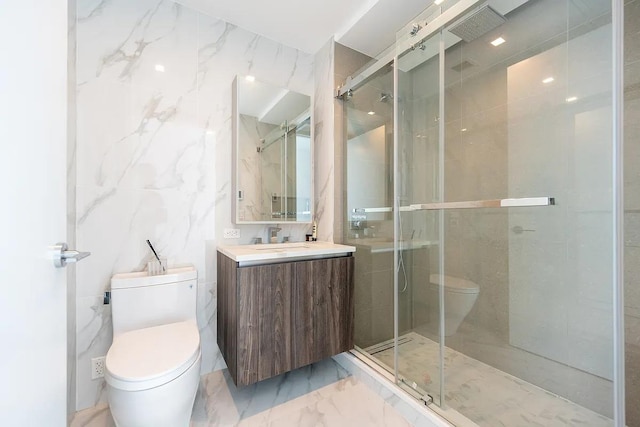 full bathroom with toilet, marble finish floor, and a stall shower