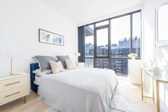 33-66 Farrington St Unit 15G, Flushing, NY 11354 - bedroom featuring a city view and light wood-style flooring