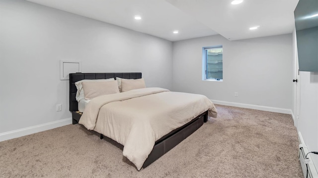 26 Boxtree Rd, East Quogue, NY 11942 - bedroom featuring baseboard heating, carpet floors, recessed lighting, and baseboards