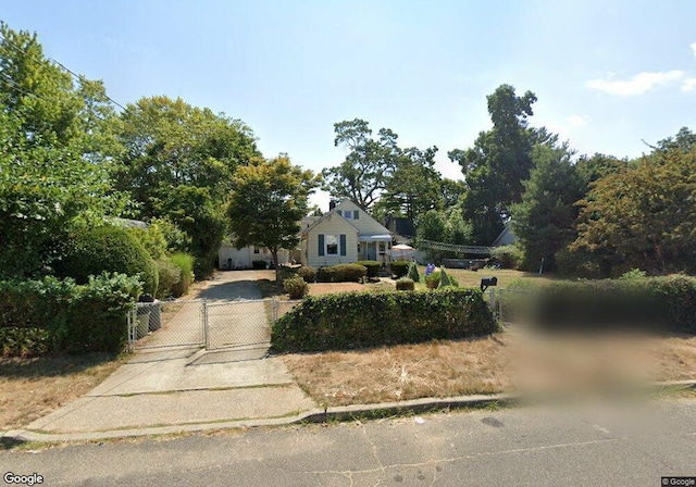 view of front of home with a gate