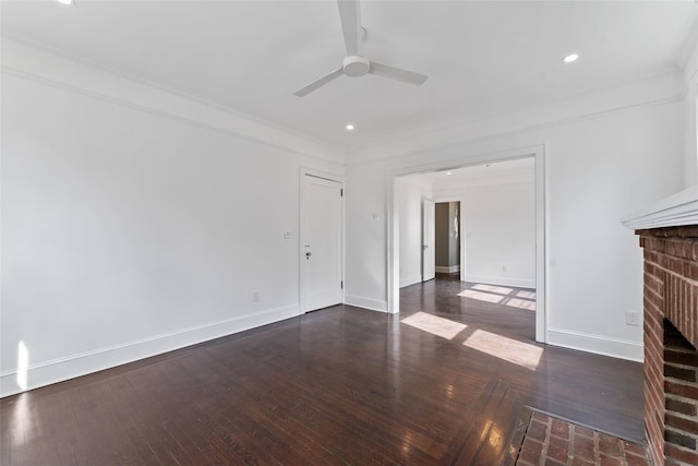 unfurnished living room featuring ceiling fan, a fireplace, baseboards, and hardwood / wood-style flooring