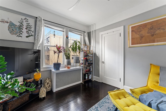 interior space featuring baseboards and wood finished floors