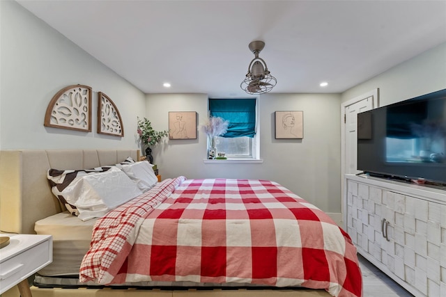 bedroom with recessed lighting and wood finished floors