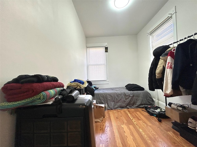 bedroom with wood finished floors