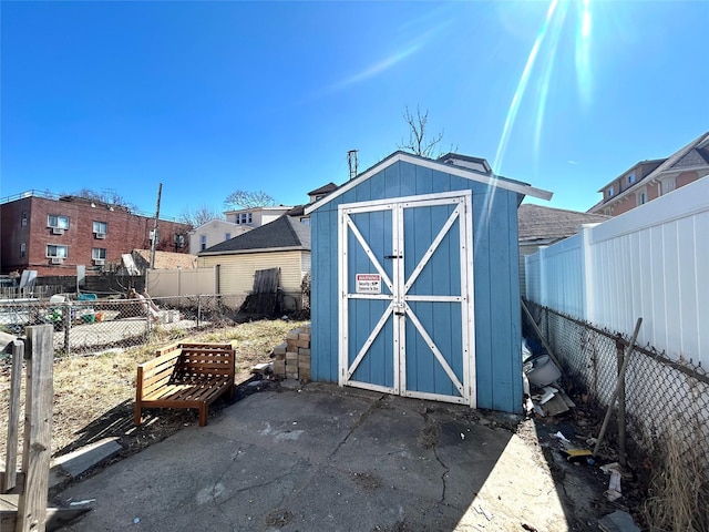 view of shed featuring a fenced backyard