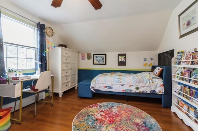 bedroom featuring ceiling fan, wood finished floors, and lofted ceiling