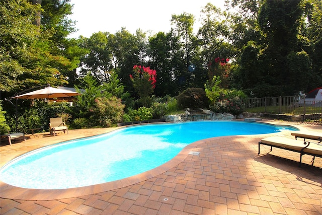 view of pool featuring a fenced in pool, a patio, and fence