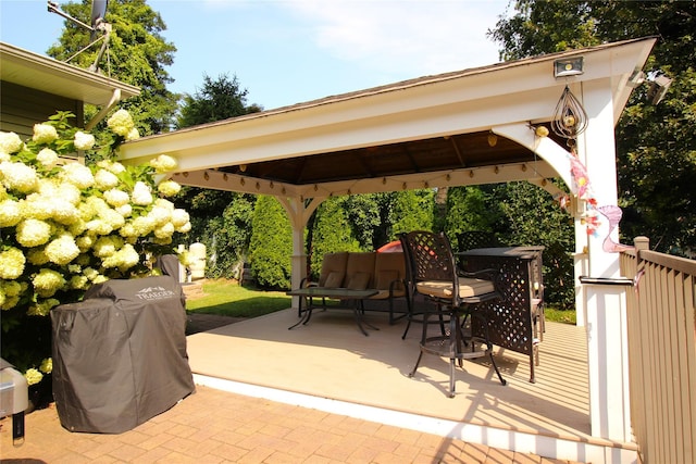 view of patio / terrace with outdoor dining space, a gazebo, and a grill